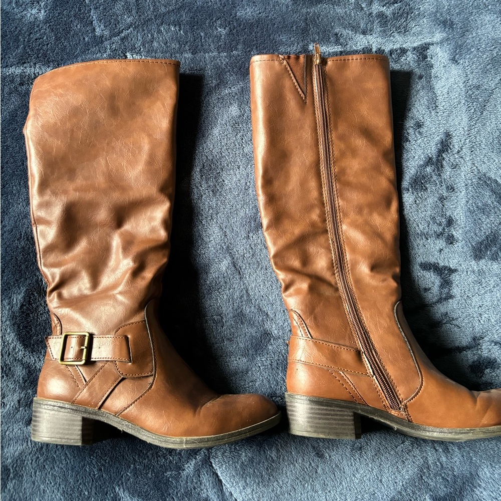 Tall brown heeled boots in near perfect condition.
